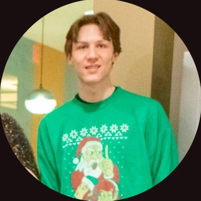 Photograph of Tom Clark in an ugly sweatshirt